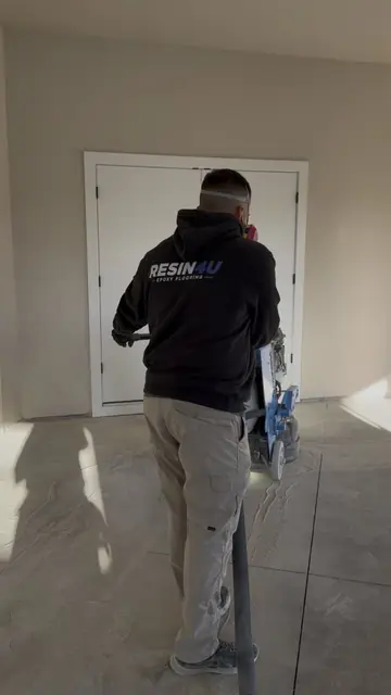 Resin4U crew diamond grinding a garage slab