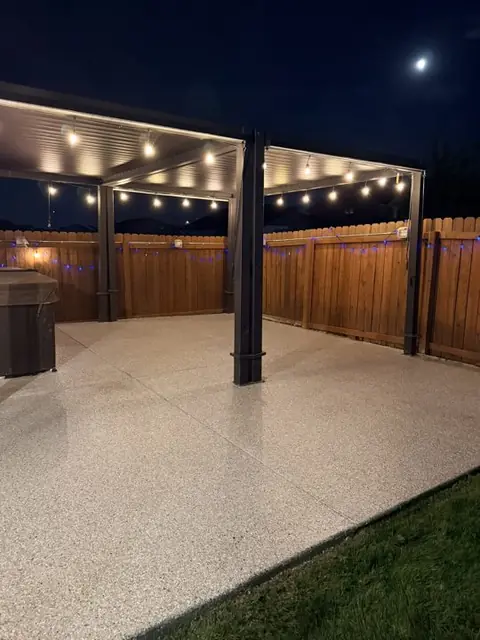Resin4U: flake patio under a lit pergola at night