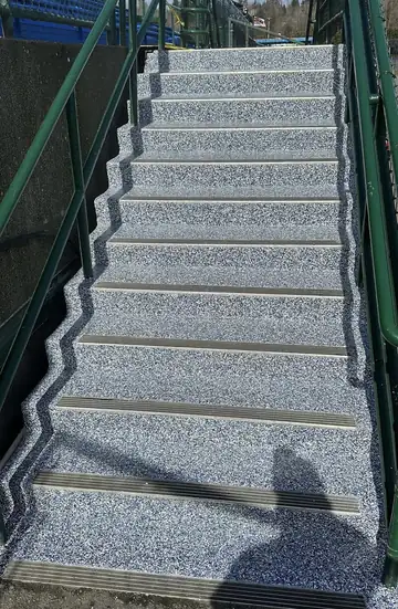 Blue and gray flake epoxy coating on outdoor commercial stairs with aluminum stair nosing